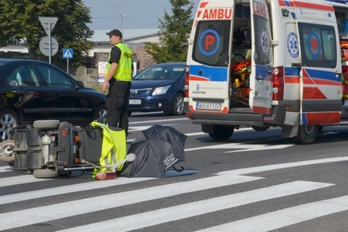 Kobieta na wózku pod kołami bmw